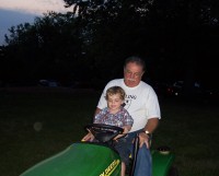 Grandpa Dan and Mark on tractor