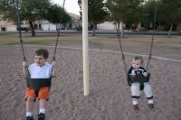 Mark and Andrew on swings at park