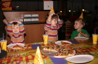 Andrew, Mark, and Adam eating pizza