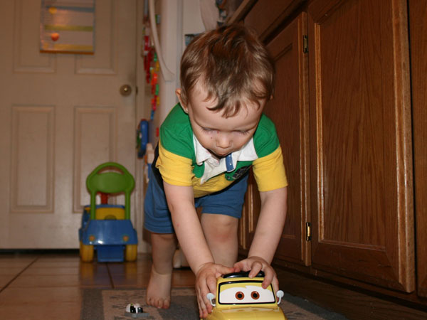 05_17_2009at13_17_40__IMG_6099__Andrew_playing_with_Luigi_toy_from_Cars_movie